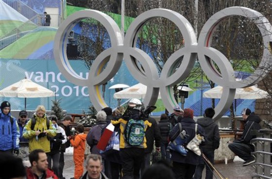 People walk through downtown Whistler, British Columbia. The resort may be put up for sale by cash-strapped owner.